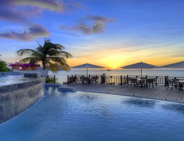 View of the split level swimming pools at sunrise at Cap Maison in St Lucia