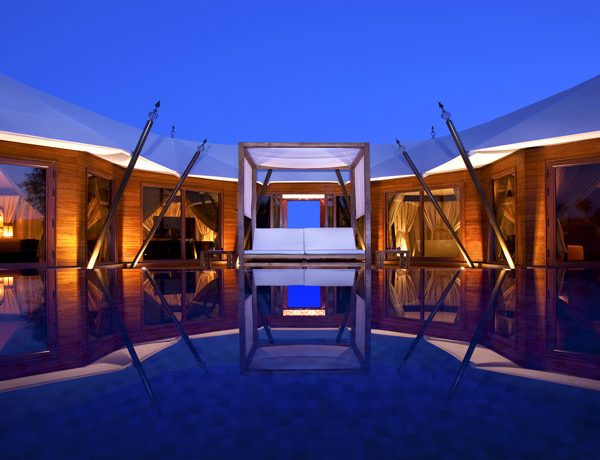 Exterior view at night of the Ritz-Carlton Ras Al Khaimah, Al Wadi Desert, UAE